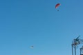 two paragliders enjoying the flight over the blue sky Royalty Free Stock Photo