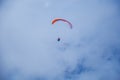 Two paragliders flying in the clouds near lake Garda