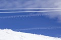 Two parallel ropes covered by icy snow on a background of blue sky with clouds making line forms