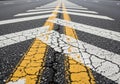 Two parallel yellow lines and zigzag white lines are painted on an Royalty Free Stock Photo