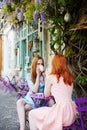 Two Parisian women drinking coffee together in cafe