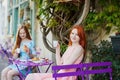 Two Parisian women drinking coffee together in cafe