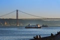 Two passenger boats Cacilheiros crossing the Tagus River in Lisbon, Portugal
