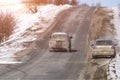 two passenger cars on a winter road