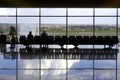 Two passengers waiting in airport lounge Royalty Free Stock Photo