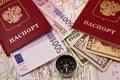 Two passport with the money and compass Royalty Free Stock Photo
