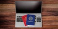 Two passports on computer keyboard, wooden background, view from above. 3d illustration Royalty Free Stock Photo