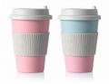 Two Pastel Colored Coffee Cups with White Lids on a White Background Royalty Free Stock Photo