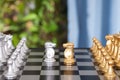 Two pawns and two horse pawns facing each other in close quarters on the chess board Royalty Free Stock Photo