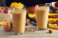 Two Peach Mango Smoothies in Glasses Royalty Free Stock Photo