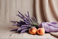 Two peachs and a bunch of lavender on the table Royalty Free Stock Photo