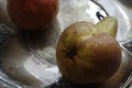 Pears on a silver plate still life design Royalty Free Stock Photo