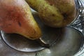 Pears on a silver plate still life design Royalty Free Stock Photo