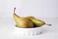 Two pears in porcelain dish Royalty Free Stock Photo