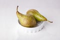 Two pears in porcelain dish Royalty Free Stock Photo