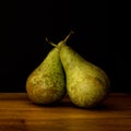 two pears on a wooden table