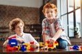 Redhead little kid playing with his older brother Royalty Free Stock Photo