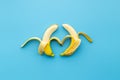 Two peeled bananas together in shape of couple in love. Frendship concept
