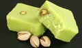 Two peices of pistachio barfi Royalty Free Stock Photo