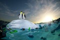 Two penguin looking around and see ocean with plastic garbage. High quality 3d illustration render Royalty Free Stock Photo