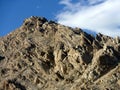 Two people climbing to the top of the rough mountain, near Shey Palace, Leh area, Ladakh