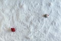 Two people dolls in winter clothes go away from each other on the snow. Aerial, top view. Concept of broken relationship