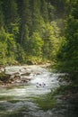 Two people drifting boat swift mountain river