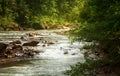 Two people drifting boat swift mountain river