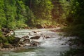 Two people drifting boat swift mountain river