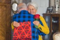 Two people embracing each other. Elderly caucasian couple celebrates birthday, valentines, or anniversary. Friendly Royalty Free Stock Photo