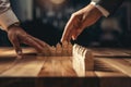 Two people engaging in playtime with wooden blocks on a table. Perfect for educational or recreational purposes Royalty Free Stock Photo