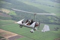Two people flying in autogyro Royalty Free Stock Photo