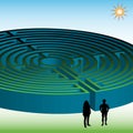 Two people in front of a maze