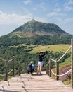 Two people getting ready to descend the Puy de Pariou stairs in summer. Royalty Free Stock Photo