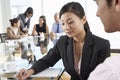 Two People Having Meeting Around Glass Table In Boardroom With C Royalty Free Stock Photo