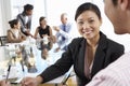 Two People Having Meeting Around Glass Table In Boardroom With C Royalty Free Stock Photo