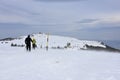 Two people hiking in the snow, severe winter weather high in Vitosha Mountain, Bulgaria Royalty Free Stock Photo