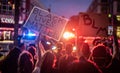 BLM signs are held infront of police cars during protest