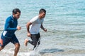 Two people jogging on the beach in the morning. Sport and healthy lifestyle Royalty Free Stock Photo