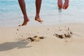 Two people are jumping on the beach Royalty Free Stock Photo