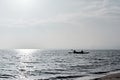 Two people in kayaks on the ocean