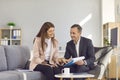 Two people meeting in office, talking, analyzing documents and discussing business matters Royalty Free Stock Photo