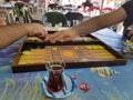 Two people playing backgammon at a village coffeehouse