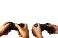 Two people are playing, holding joysticks on a white background. Isolated Royalty Free Stock Photo
