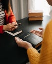 Two people reading and study bible in home and pray together.Studying the Word Of God With Friends Royalty Free Stock Photo