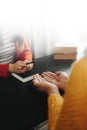 Two people reading and study bible in home and pray together.Studying the Word Of God With Friends Royalty Free Stock Photo