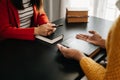 Two people reading and study bible in home and pray together.Studying the Word Of God With Friends Royalty Free Stock Photo