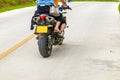 Two people are riding motorcycles on the road Royalty Free Stock Photo