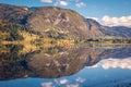 Two people row on Lake Bohinj in Slovenia on a clear autumn day Royalty Free Stock Photo