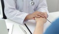 Two people shaking hands, Doctor comforted or encouraged the patient in the operating room of the hospital